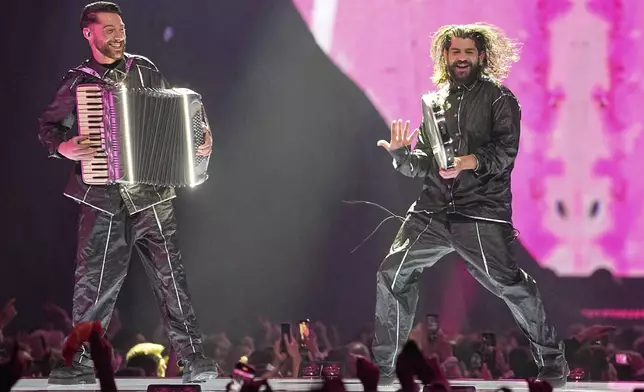 KAJ from Sweden performs the song "Bara Bada Bastu" during the Grand Final of the 69th Eurovision Song Contest, in Basel, Switzerland, Saturday, May 17, 2025. (AP Photo/Martin Meissner)
