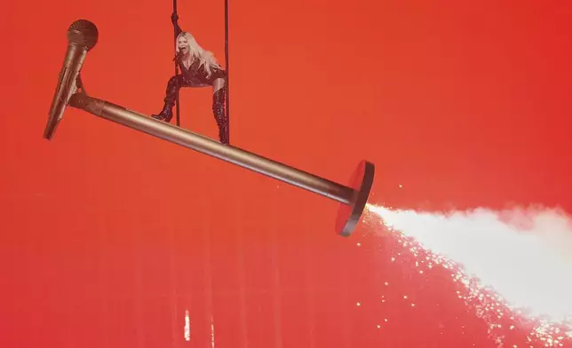 Erika Vikman from Finland performs the song "ICH KOMME" during the Grand Final of the 69th Eurovision Song Contest, in Basel, Switzerland, Saturday, May 17, 2025. (AP Photo/Martin Meissner)