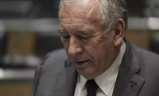 French Prime Minister Francois Bayrou arrives to face questions from a parliamentary inquiry into alleged abuse at a Catholic school amid accusations he has hidden what he knows about the scandal, in Paris, Wednesday May 14, 2025. (AP Photo/Aurelien Morissard)