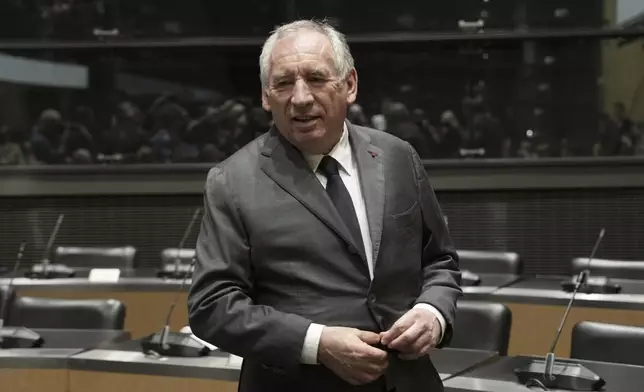 French Prime Minister Francois Bayrou arrives to face questions from a parliamentary inquiry into alleged abuse at a Catholic school amid accusations he has hidden what he knows about the scandal, in Paris, Wednesday May 14, 2025. (AP Photo/Aurelien Morissard)