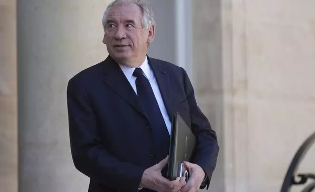 FILE - France's Prime Minister Francois Bayrou leaves the weekly cabinet meeting, Wednesday, March 19, 2025 at the Elysee Palace in Paris. (AP Photo/Thibault Camus, File)