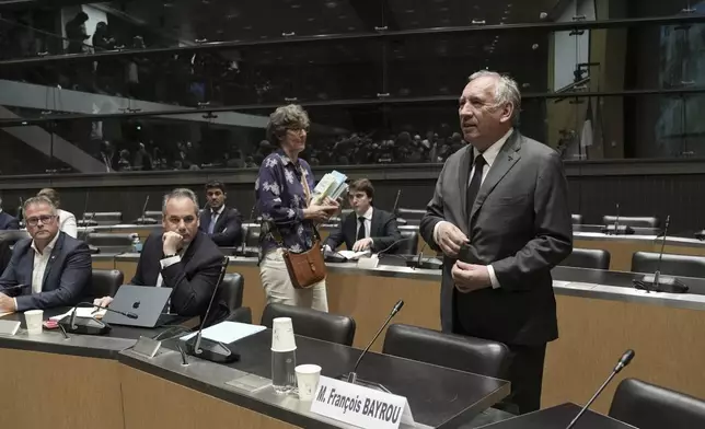 French Prime Minister Francois Bayrou arrives to face questions from a parliamentary inquiry into alleged abuse at a Catholic school amid accusations he has hidden what he knows about the scandal, in Paris, Wednesday May 14, 2025. (AP Photo/Aurelien Morissard)
