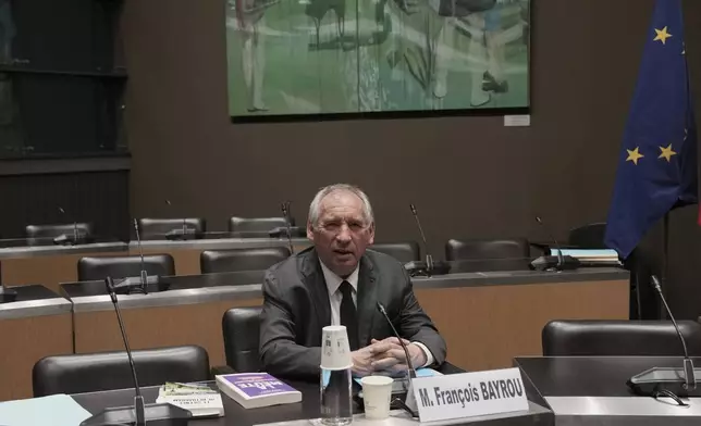 French Prime Minister Francois Bayrou arrives to face questions from a parliamentary inquiry into alleged abuse at a Catholic school amid accusations he has hidden what he knows about the scandal, in Paris, Wednesday May 14, 2025. (AP Photo/Aurelien Morissard)