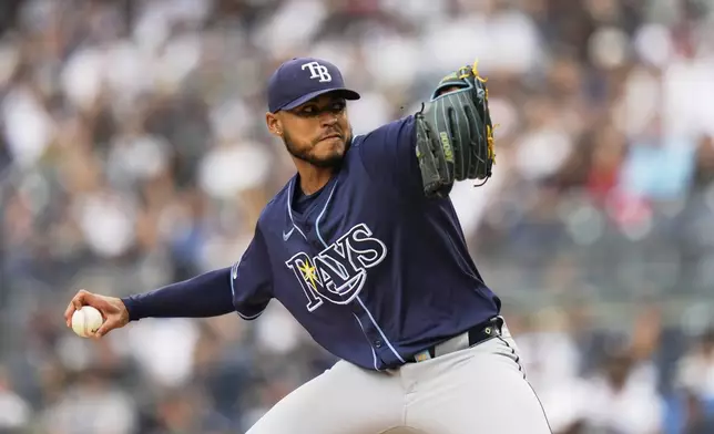 Tampa Bay Rays pitcher Taj Bradley throws during the first inning of a baseball game against the New York Yankees, Sunday, May 4, 2025, in New York. (AP Photo/Seth Wenig)