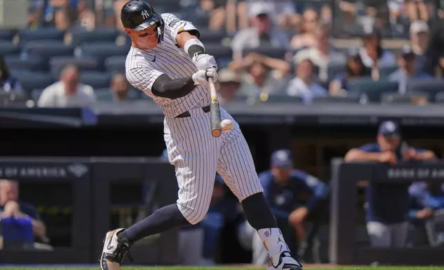 New York Yankees' Aaron Judge hits a single during the sixth inning of a baseball game against the Tampa Bay Rays, Saturday, May 3, 2025, in New York. (AP Photo/Frank Franklin II)