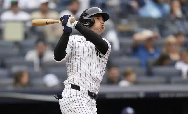 New York Yankees' Cody Bellinger watches his two-run home runduring the sixth inning of a baseball game against the Tampa Bay Rays, Sunday, May 4, 2025, in New York. (AP Photo/Seth Wenig)