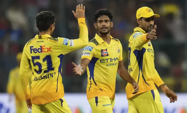 Chennai Super Kings' Matheesha Pathirana, center, celebrates with teammates the dismissal of Royal Challengers Bengaluru's captain Rajat Patidar during the Indian Premier League cricket match between Royal Challengers Bengaluru and Chennai Super Kings at Chinnaswamy Stadium in Bengaluru, India, Saturday, May 3, 2025. (AP Photo/Aijaz Rahi)