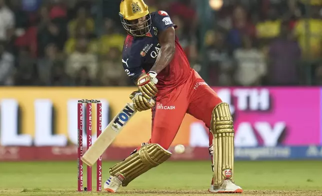 Royal Challengers Bengaluru's Romario Shepherd plays a shot during the Indian Premier League cricket match between Royal Challengers Bengaluru and Chennai Super Kings at Chinnaswamy Stadium in Bengaluru, India, Saturday, May 3, 2025. (AP Photo/Aijaz Rahi)