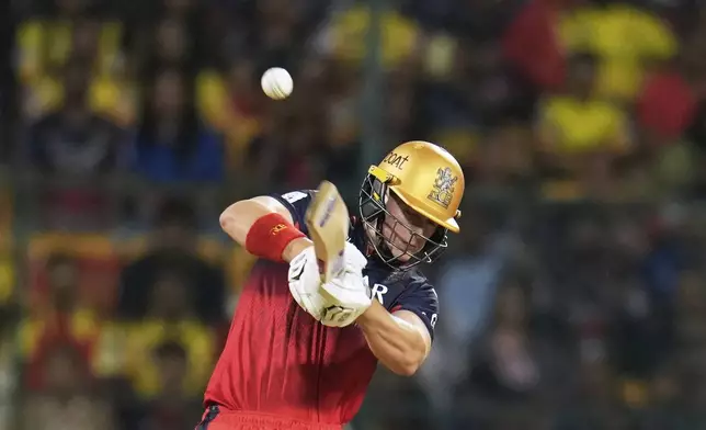 Royal Challengers Bengaluru's Jacob Bethell plays a shot during the Indian Premier League cricket match between Chennai Super Kings and Royal Challengers Bengaluru at Chinnaswamy Stadium in Bengaluru, India, Saturday, May 3, 2025. (AP Photo/Aijaz Rahi)