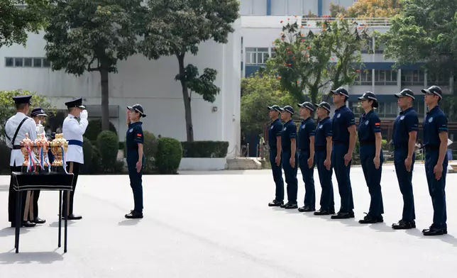 Commissioner of Police inspects passing-out parade of Police Cadet Training at HK Police College  Source: HKSAR Government Press Releases