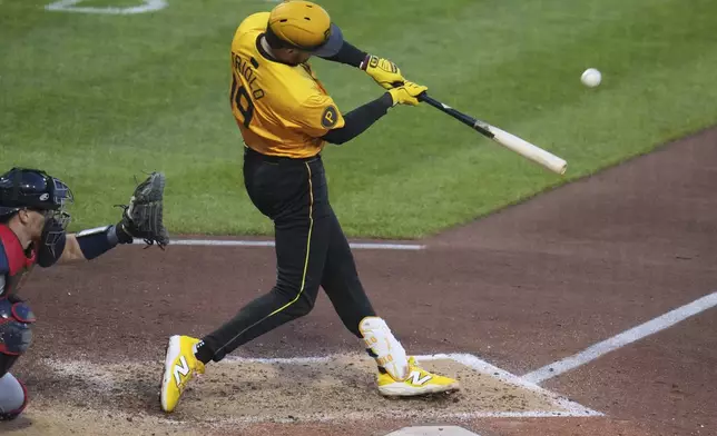 Pittsburgh Pirates' Jared Triolo hits a solo home run off Atlanta Braves pitcher Bryce Elder during the sixth inning of a baseball game in Pittsburgh, Friday, May 9, 2025. (AP Photo/Gene J. Puskar)