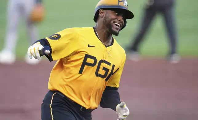 Pittsburgh Pirates' Alexander Canario celebrates as he rounds third after hitting a solo home run off Atlanta Braves pitcher Bryce Elder during the third inning of a baseball game in Pittsburgh, Friday, May 9, 2025. (AP Photo/Gene J. Puskar)