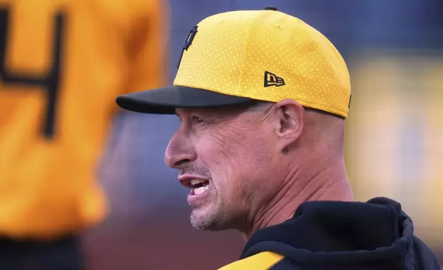 Pittsburgh Pirates manager Don Kelly stands in the dugout during the first inning of a baseball game against the Atlanta Braves in Pittsburgh, Friday, May 9, 2025. (AP Photo/Gene J. Puskar)