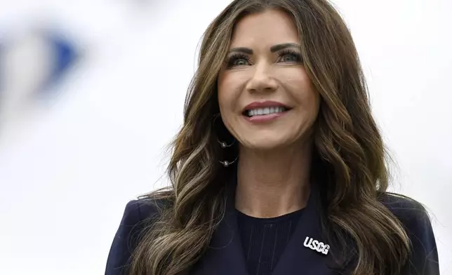 Homeland Security Secretary Kristi Noem smiles at the commencement for the United States Coast Guard Academy, Wednesday, May 21, 2025 in New London, Conn. (AP Photo/Jessica Hill)