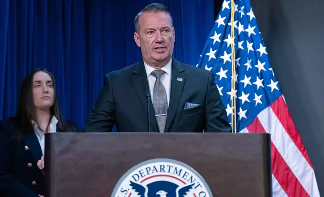Acting director of U.S. Immigration and Customs Enforcement (ICE) Todd Lyons flanked by Deputy director of U.S. Immigration and Customs Enforcement Madison Sheahan, speaks during a news conference at ICE Headquarters, in Washington, Wednesday, May 21, 2025. (AP Photo/Jose Luis Magana)