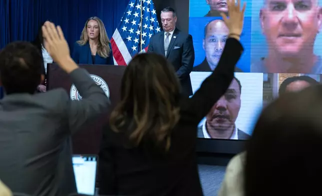 DHS Assistant Secretary for Public Affairs Tricia McLaughlin flanked by Acting director of U.S. Immigration and Customs Enforcement Todd Lyons speaks during a news conference at ICE Headquarters, in Washington, Wednesday, May 21, 2025. (AP Photo/Jose Luis Magana)