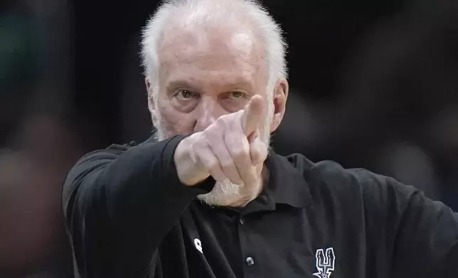 FILE - San Antonio Spurs head coach Gregg Popovich points from the bench in the second half of an NBA basketball game against the Boston Celtics, Sunday, March 26, 2023, in Boston. (AP Photo/Steven Senne, File)