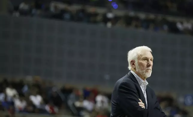 FILE - San Antonio Spurs head coach Gregg Popovich looks on during the second half of their regular-season NBA basketball game against the Phoenix Suns in Mexico City, Saturday, Dec. 14, 2019. (AP Photo/Rebecca Blackwell, File)