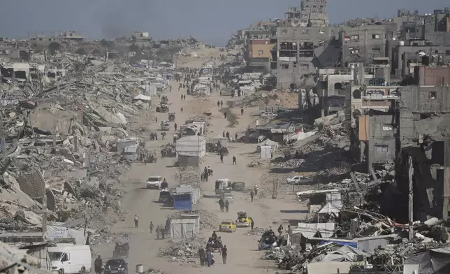 Displaced Palestinians fleeing Beit Lahia amid ongoing Israeli military operations in the Gaza Strip arrive in Jabalia, northern Gaza, on Friday, May 16, 2025. (AP Photo/Jehad Alshrafi)