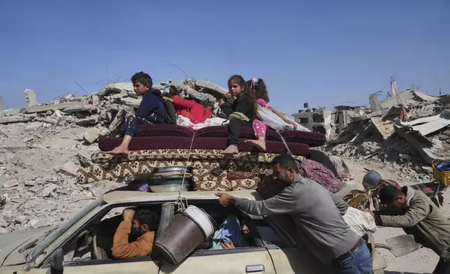 Displaced Palestinians fleeing Beit Lahia amid ongoing Israeli military operations in the Gaza Strip arrive in Jabalia, northern Gaza, on Friday, May 16, 2025. (AP Photo/Jehad Alshrafi)
