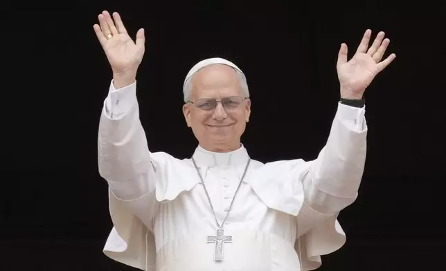 Pope Leo XIV appears at the central balcony of St. Peter's Basilica for his first Sunday blessing after his election, in St. Peter's Square at the Vatican, Sunday, May 11, 2025.(AP Photo/Gregorio Borgia)