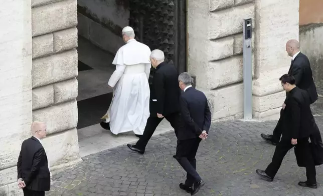 Pope Leo XIV arrives for his first Sunday blessing after his election, at the Vatican, Sunday May 11, 2025. (AP Photo/Alessandra Tarantino)