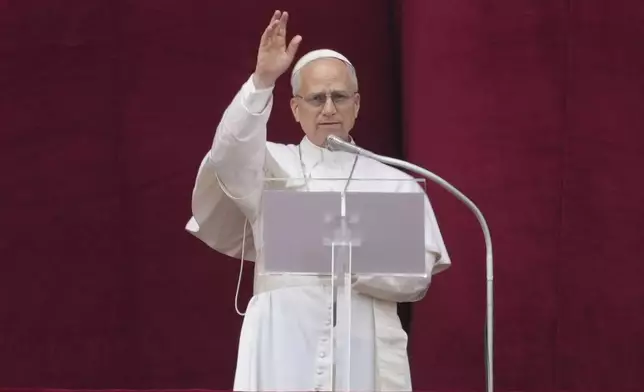 Pope Leo XIV delivers his blessing from the central balcony of St. Peter's Basilica for his first Sunday blessing after his election, in St. Peter's Square at the Vatican, Sunday, May 11, 2025.(AP Photo/Andrew Medichini)