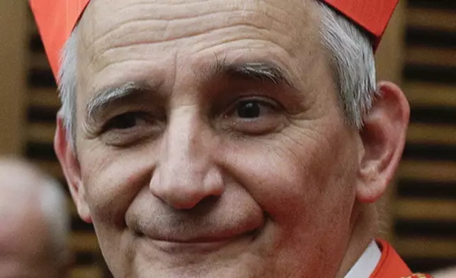 FILE - Cardinal Matteo Zuppi poses for photographers at the Vatican on Oct. 5, 2019. (AP Photo/Andrew Medichini, File)