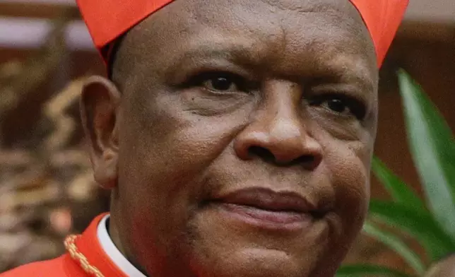 FILE - Cardinal Fridolin Ambongo Besungu poses for photographers at the Vatican on Oct. 5, 2019. (AP Photo/Andrew Medichini, File)