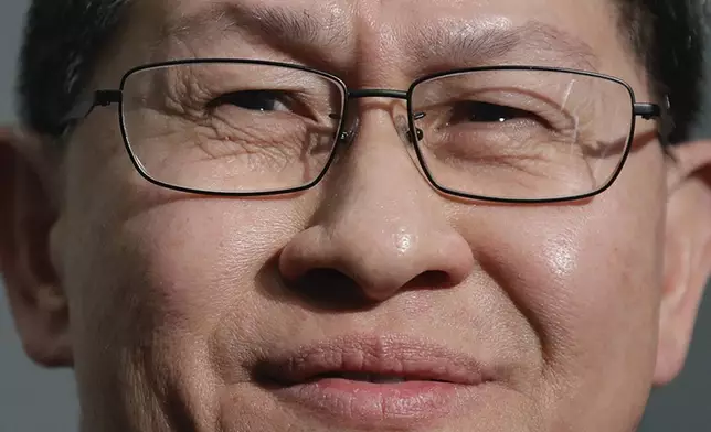 FILE - Cardinal Luis Antonio Tagle smiles during a news conference at the Vatican on Oct. 23, 2018. (AP Photo/Alessandra Tarantino, File)