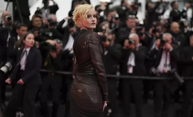 CORRECTED NAME SPELLING - Julia Garner poses for photographers during the opening ceremony red carpet of the 78th international film festival, Cannes, southern France, Tuesday, May 13, 2025. (Photo by Joel C Ryan/Invision/AP)