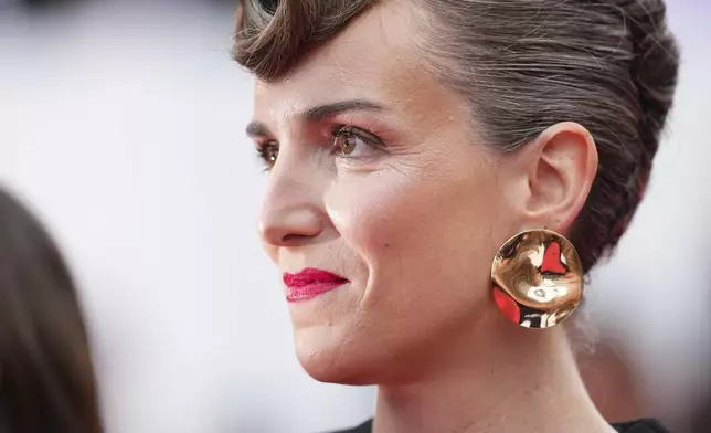 Director Amelie Bonnin poses for photographers during the opening ceremony red carpet of the 78th international film festival, Cannes, southern France, Tuesday, May 13, 2025. (Photo by Scott A Garfitt/Invision/AP)