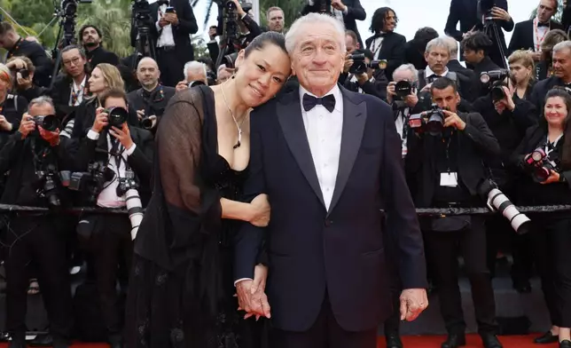 Tiffany Chen, left, and Robert De Niro pose for photographers during the opening ceremony red carpet of the 78th international film festival, Cannes, southern France, Tuesday, May 13, 2025. (Photo by Joel C Ryan/Invision/AP)