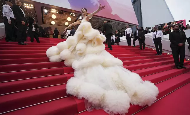 Wan QianHui poses for photographers during the opening ceremony red carpet of the 78th international film festival, Cannes, southern France, Tuesday, May 13, 2025. (AP Photo/Natacha Pisarenko)