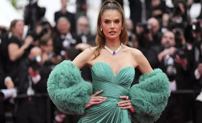 Alessandra Ambrosio poses for photographers during the opening ceremony red carpet of the 78th international film festival, Cannes, southern France, Tuesday, May 13, 2025. (Photo by Scott A Garfitt/Invision/AP)