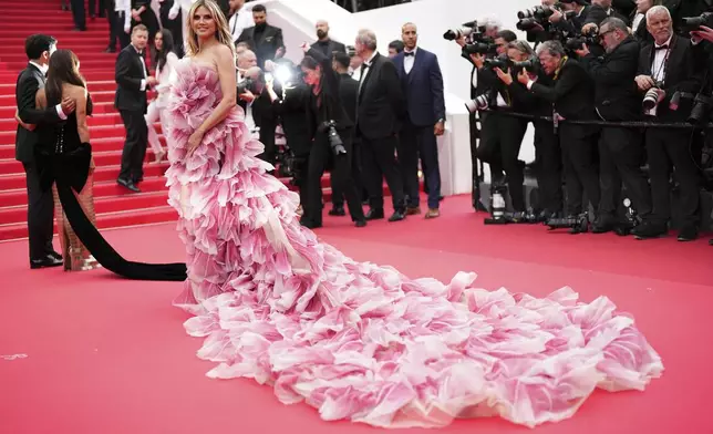 Heidi Klum poses for photographers during the opening ceremony red carpet of the 78th international film festival, Cannes, southern France, Tuesday, May 13, 2025. (Photo by Scott A Garfitt/Invision/AP)
