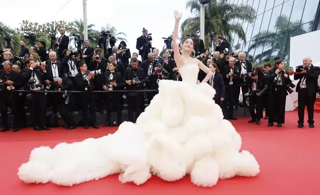 Wan QianHui poses for photographers during the opening ceremony red carpet of the 78th international film festival, Cannes, southern France, Tuesday, May 13, 2025. (Photo by Joel C Ryan/Invision/AP)