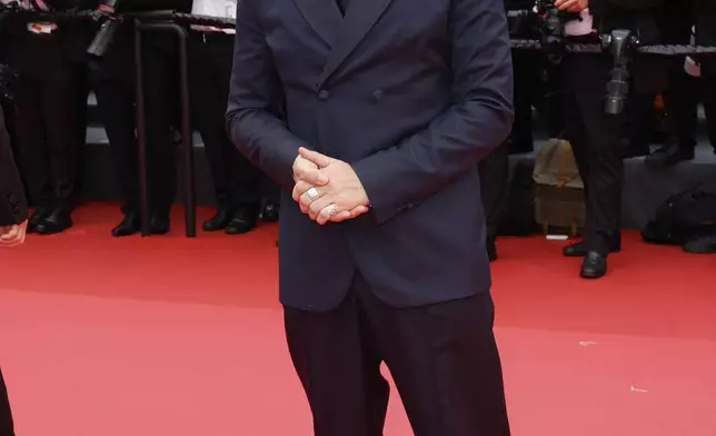 Fatih Akin poses for photographers during the opening ceremony red carpet of the 78th international film festival, Cannes, southern France, Tuesday, May 13, 2025. (Photo by Joel C Ryan/Invision/AP)