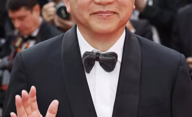 Hirokazu Kore-eda poses for photographers during the opening ceremony red carpet of the 78th international film festival, Cannes, southern France, Tuesday, May 13, 2025. (Photo by Joel C Ryan/Invision/AP)