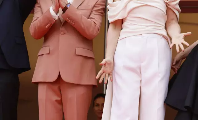 Jury member Jeremy Strong, left, and jury president Juliette Binoche pose for photographers during the opening ceremony red carpet of the 78th international film festival, Cannes, southern France, Tuesday, May 13, 2025. (Photo by Joel C Ryan/Invision/AP)