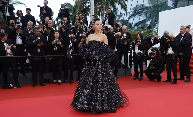 Irina Shayk poses for photographers during the opening ceremony red carpet of the 78th international film festival, Cannes, southern France, Tuesday, May 13, 2025. (Photo by Joel C Ryan/Invision/AP)
