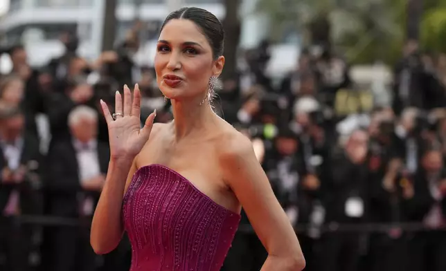 Alice Abdel Aziz poses for photographers during the opening ceremony red carpet of the 78th international film festival, Cannes, southern France, Tuesday, May 13, 2025. (AP Photo/Natacha Pisarenko)