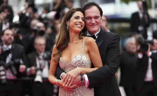 Daniella Pick, left, and Quentin Tarantino pose for photographers during the opening ceremony red carpet of the 78th international film festival, Cannes, southern France, Tuesday, May 13, 2025. (Photo by Scott A Garfitt/Invision/AP)