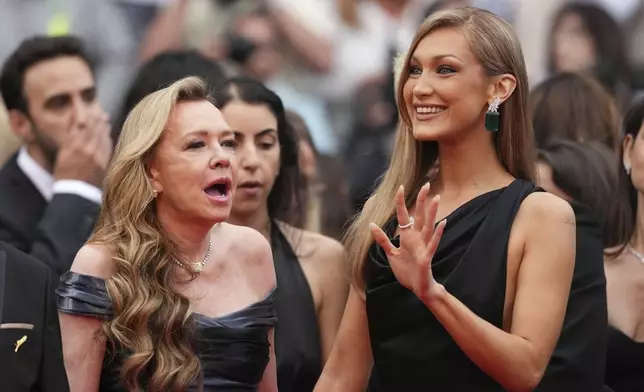 Christine Scheufele, left, and Bella Hadid pose for photographers during the opening ceremony red carpet of the 78th international film festival, Cannes, southern France, Tuesday, May 13, 2025. (Photo by Scott A Garfitt/Invision/AP)