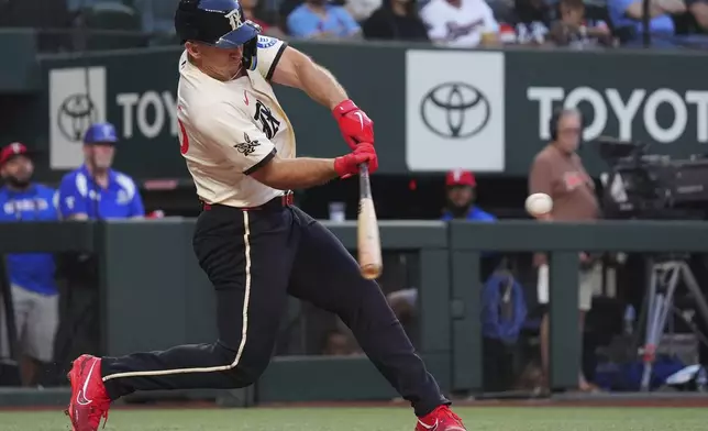 Texas Rangers' Wyatt Langford hits a home run during the second inning of a baseball game against the St. Louis Cardinals, Friday, May 30, 2025, in Arlington, Texas. (AP Photo/LM Otero)