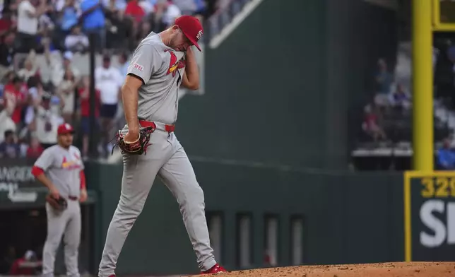 St. Louis Cardinals starting pitcher Matthew Liberatore reacts to giving up a home run to Texas Rangers' Wyatt Langford during the second inning of a baseball game, Friday, May 30, 2025, in Arlington, Texas. (AP Photo/LM Otero)