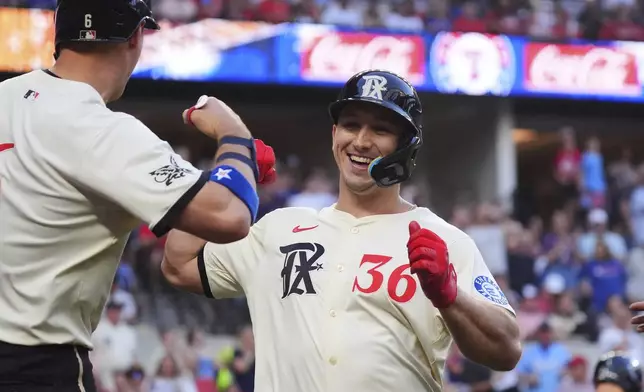 Texas Rangers' Wyatt Langford (36) celebrates hitting a home run during the second inning of a baseball game against the St. Louis Cardinals, Friday, May 30, 2025, in Arlington, Texas. (AP Photo/LM Otero)