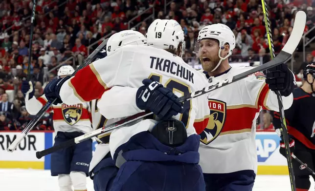 The Florida Panthers celebrate a goal by Gustav Forsling (42) during the first period of Game 2 of the NHL hockey Stanley Cup Eastern Conference finals against the Carolina Hurricanes in Raleigh, N.C., Thursday, May 22, 2025. (AP Photo/Karl DeBlaker)