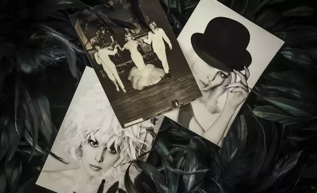 Cabaret photographs of Marie-Pierre Pruvot known as Bambi, one of the first trans women in the world to become a public star, and a pioneer in global LGBTQ+ history, are displayed during an interview with the Associated Press, in Pantin, outside Paris, Thusday, May 20, 2025. (AP Photo/Thomas Padilla)