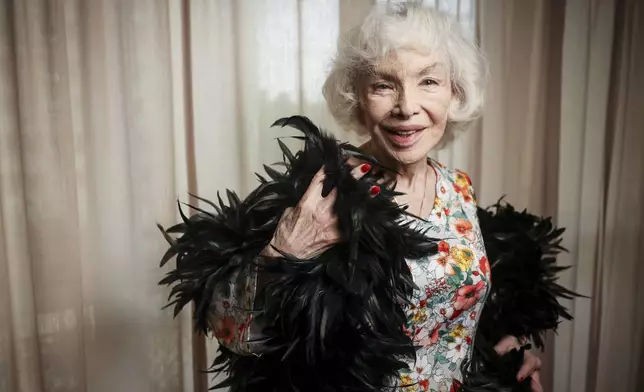 Marie-Pierre Pruvot, 89, known as Bambi, one of the first trans women in the world to become a public star, and a pioneer in global LGBTQ+ history, poses after an interview with the Associated Press, in Pantin, outside Paris, Tuesday, May 20, 2025. (AP Photo/Thomas Padilla)